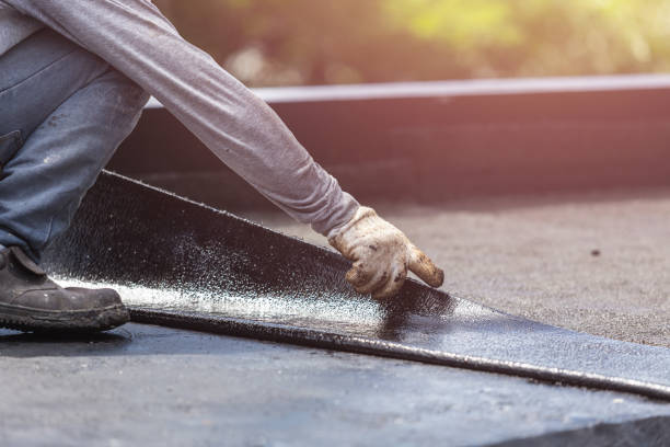 Professional Basement Waterproofing technician working in Franklin, NC
